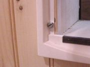Screw into wall using pan head screw