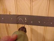 Drill a series of holes to locate the stud