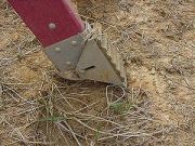 Feet dug into ground