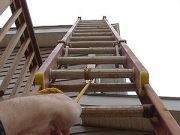 Raising extension ladder