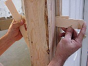 Use shims to position door