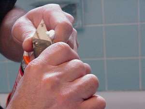 Trim end of caulk tube