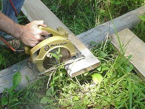 Saw top fence board to length