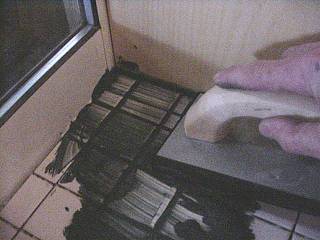 Sponge grout into corners