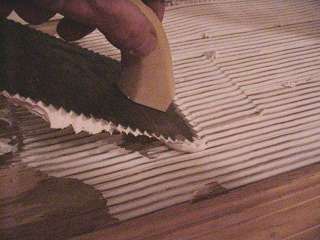 Spread mastic with trowel at 45 degree angle